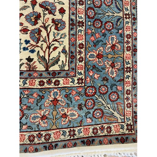 1236 - A Persian cream ground rug, 205 x 142 cm