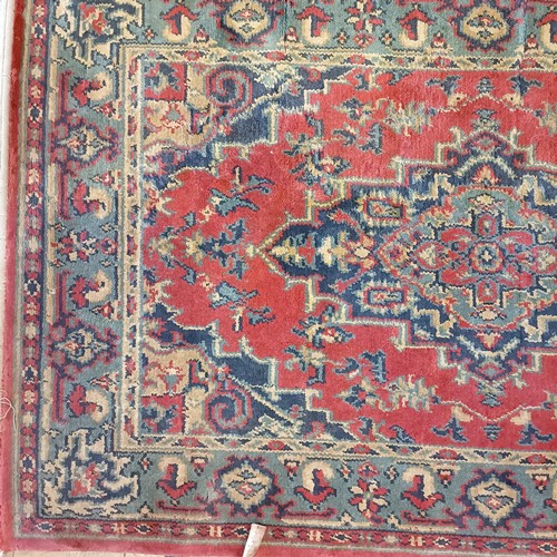 1205 - An Afghan red ground rug, 222 x 129 cm, and a red ground rug, 150 x 90 cm (2)