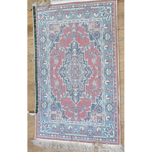 1205 - An Afghan red ground rug, 222 x 129 cm, and a red ground rug, 150 x 90 cm (2)