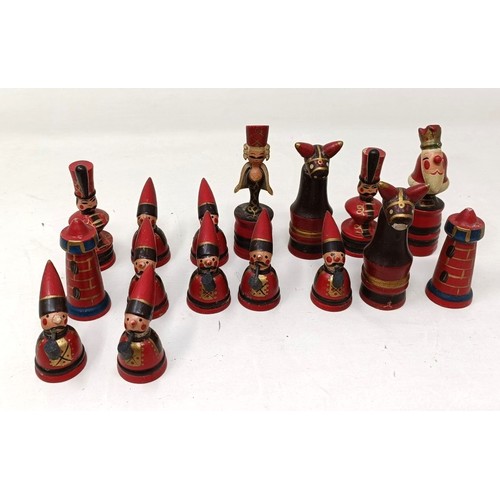 1029 - A novelty carved wood and painted chess set, the king 8 cm high