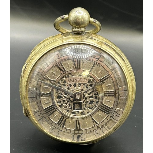 813 - A George III pair cased pocket watch, the champlevé dial with a date aperture and signed Skinner, wi... 