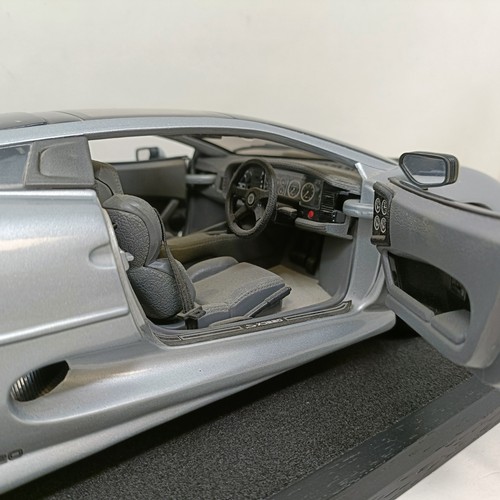 230 - A Maisto 1:12 model of a Jaguar XJ220, in a display case