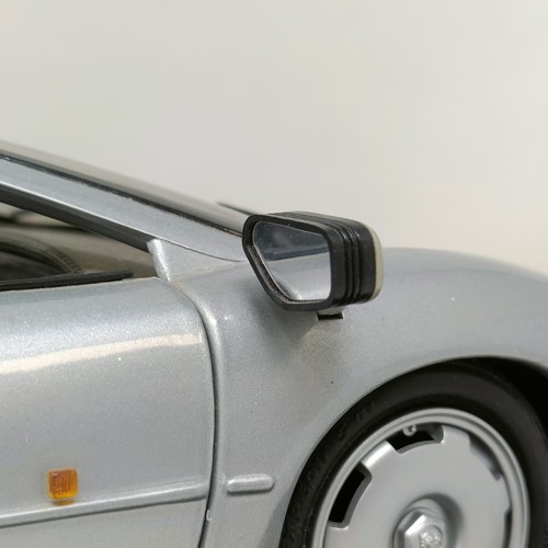 230 - A Maisto 1:12 model of a Jaguar XJ220, in a display case