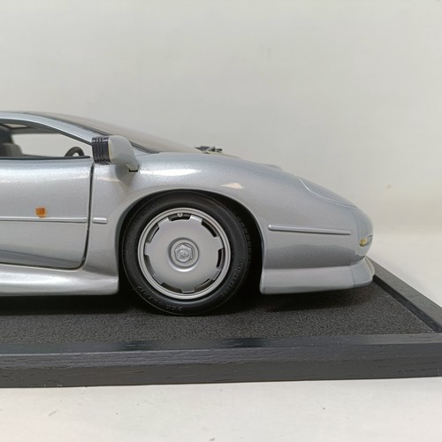 230 - A Maisto 1:12 model of a Jaguar XJ220, in a display case