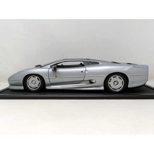 230 - A Maisto 1:12 model of a Jaguar XJ220, in a display case