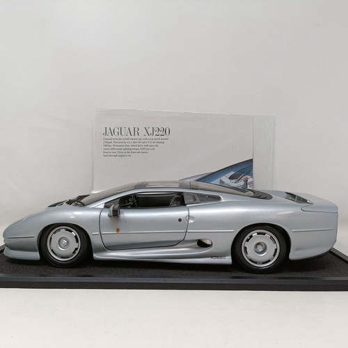 230 - A Maisto 1:12 model of a Jaguar XJ220, in a display case