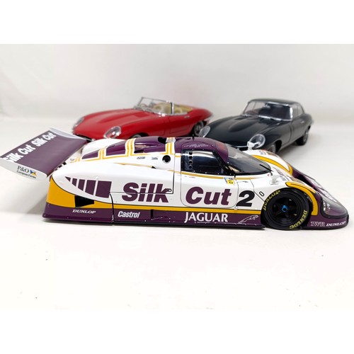 231 - A Motorbox 1:18 model of a Jaguar XJR-9, and two Autoart 1:18 models of an E-Type Jaguar, No 0883, a... 