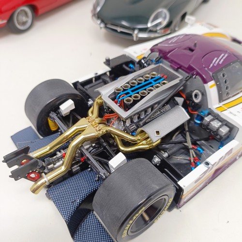 231 - A Motorbox 1:18 model of a Jaguar XJR-9, and two Autoart 1:18 models of an E-Type Jaguar, No 0883, a... 