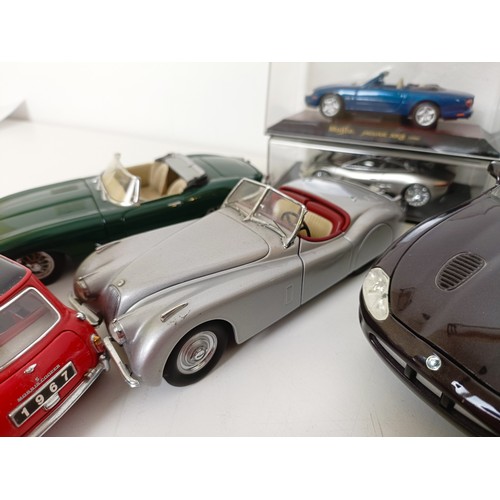 233 - An Autoart 1:18 model of a Jaguar XK SS, and assorted other models (box)