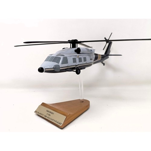 236 - A model of a Sikorsky S-70A (VH-MHB) helicopter, on a stand, 33 cm wide