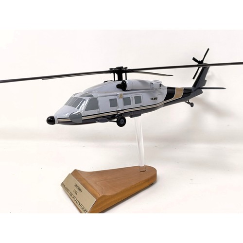 236 - A model of a Sikorsky S-70A (VH-MHB) helicopter, on a stand, 33 cm wide