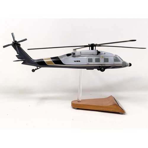 236 - A model of a Sikorsky S-70A (VH-MHB) helicopter, on a stand, 33 cm wide