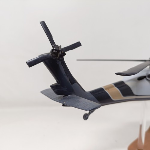 236 - A model of a Sikorsky S-70A (VH-MHB) helicopter, on a stand, 33 cm wide