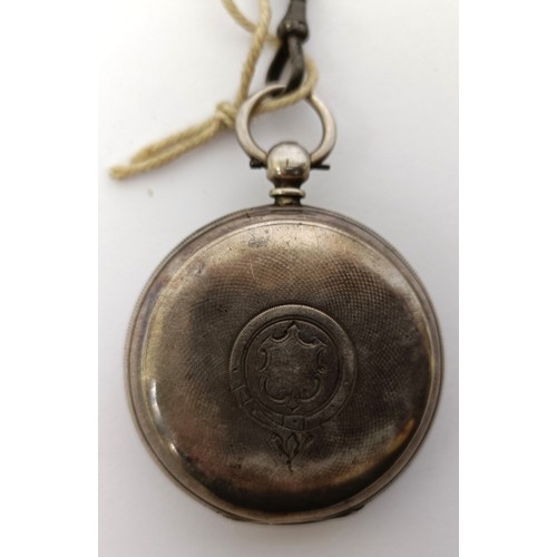 833 - A silver open face pocket watch and an Albert