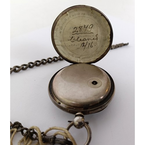 833 - A silver open face pocket watch and an Albert