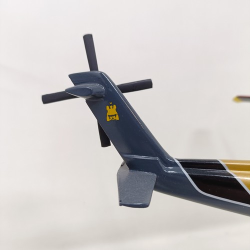 237 - A model of a Sikorsky S-76B helicopter on a stand, 33 cm wide