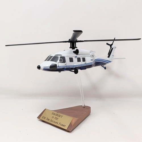 238 - A model of a Sikorsky S70C helicopter, on a stand, 31 cm