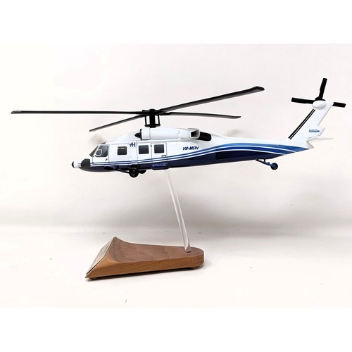 238 - A model of a Sikorsky S70C helicopter, on a stand, 31 cm