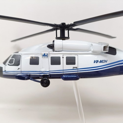 238 - A model of a Sikorsky S70C helicopter, on a stand, 31 cm