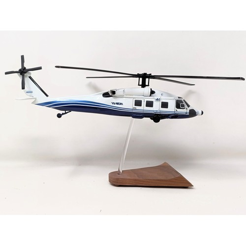 238 - A model of a Sikorsky S70C helicopter, on a stand, 31 cm