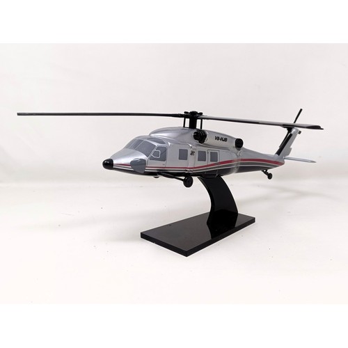 239 - A model of a Sikorsky S-70C helicopter, 33 cm wide