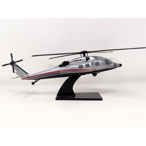 239 - A model of a Sikorsky S-70C helicopter, 33 cm wide