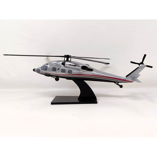 239 - A model of a Sikorsky S-70C helicopter, 33 cm wide