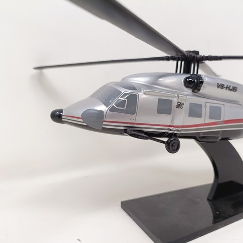 239 - A model of a Sikorsky S-70C helicopter, 33 cm wide