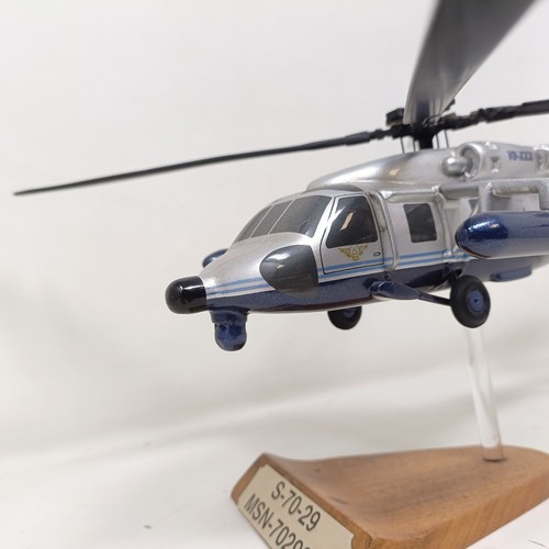 240 - A model of a Sikorsky S70-29 helicopter, 40 cm wide