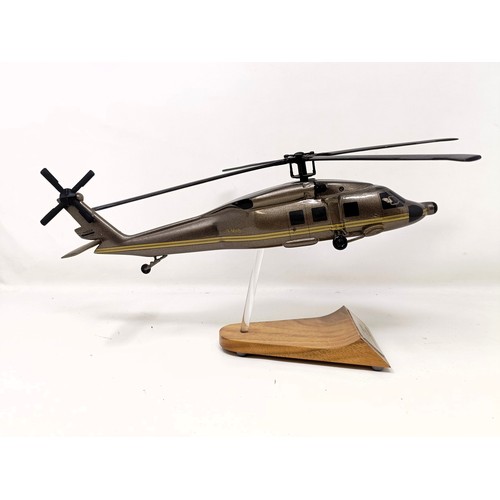 241 - A model of a Sikorsky S-70A helicopter, on a stand, 31 cm