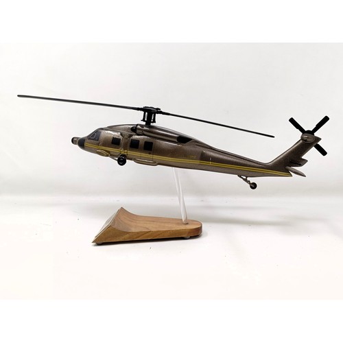 241 - A model of a Sikorsky S-70A helicopter, on a stand, 31 cm