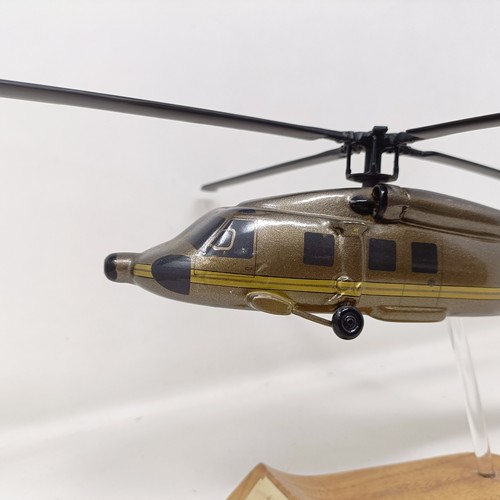 241 - A model of a Sikorsky S-70A helicopter, on a stand, 31 cm