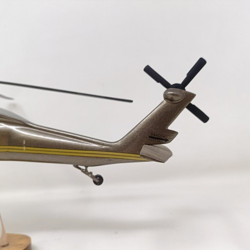 241 - A model of a Sikorsky S-70A helicopter, on a stand, 31 cm