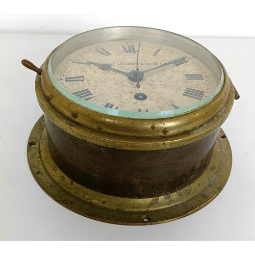 857 - A ship's brass bulkhead clock, Dobbie McInnes & Clyde Ltd., 18 cm wide