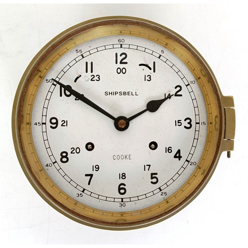 858 - A ship's brass bulkhead clock, 21 cm diameter