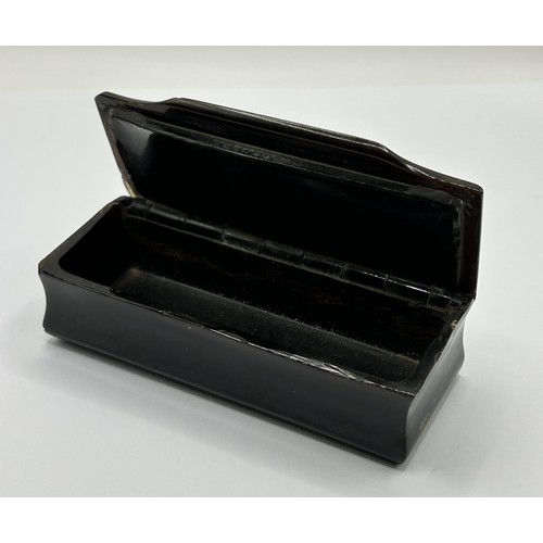 1016 - A Victorian snuff box, the top with silver coloured metal inlaid decoration, 9.5 cm wide