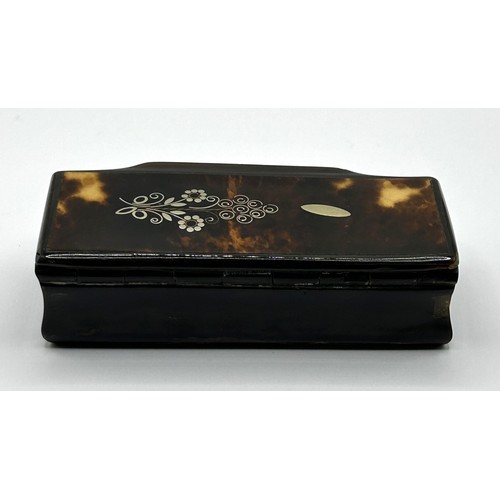 1016 - A Victorian snuff box, the top with silver coloured metal inlaid decoration, 9.5 cm wide