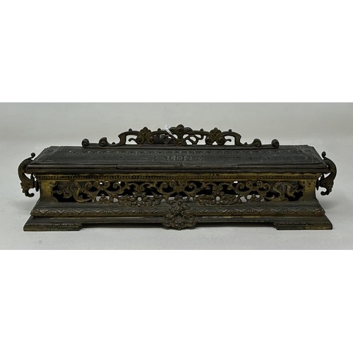 1021 - A gilt brass and bejewelled inkstand, 25 cm wide