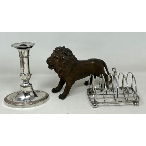 1022 - A spelter figure of a lion, 14.5 cm high, a 19th century plated on copper toast rack, and a similar ... 