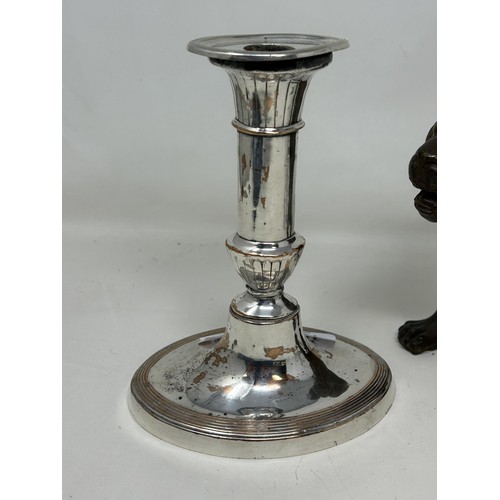 1022 - A spelter figure of a lion, 14.5 cm high, a 19th century plated on copper toast rack, and a similar ... 
