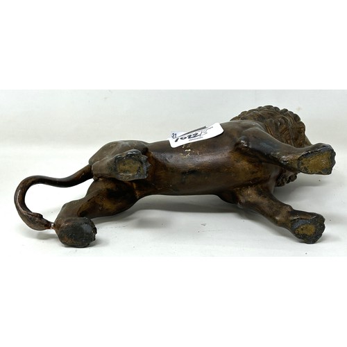 1022 - A spelter figure of a lion, 14.5 cm high, a 19th century plated on copper toast rack, and a similar ... 