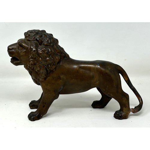 1022 - A spelter figure of a lion, 14.5 cm high, a 19th century plated on copper toast rack, and a similar ... 