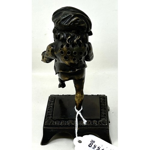 1023 - A bronze caricature figure, on a square base, possibly a hat pin stand, 13 cm high