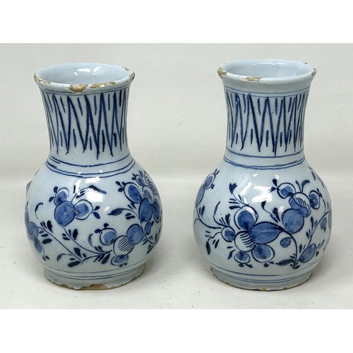 1030 - A small pair of Dutch Delft vases, 14 cm high (2)