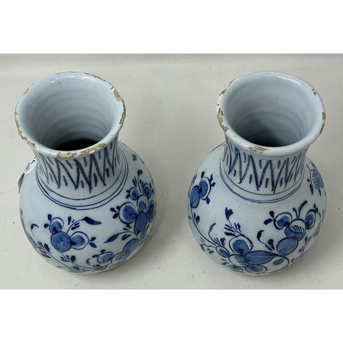1030 - A small pair of Dutch Delft vases, 14 cm high (2)