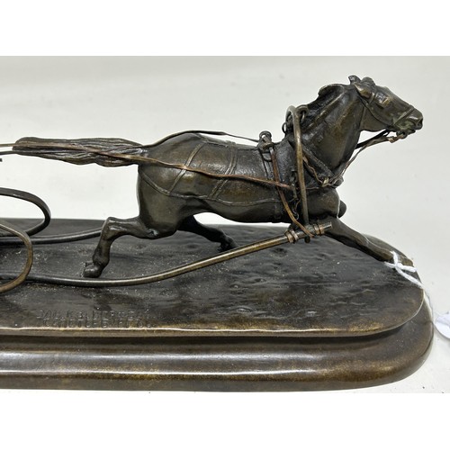 1039 - A bronze group of a Russian in a sleigh, being pulled by a horse, 23 cm wide