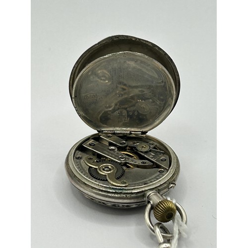 844 - A ladies silver coloured metal fob watch, in an engraved case, stamped .800, in a fitted box, with a... 