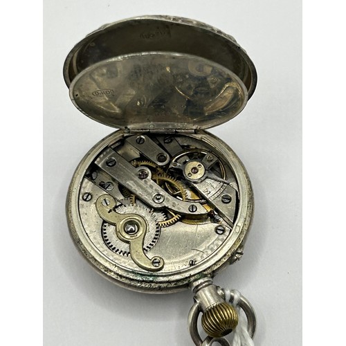 844 - A ladies silver coloured metal fob watch, in an engraved case, stamped .800, in a fitted box, with a... 