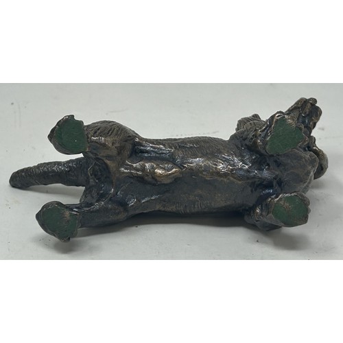 1024 - A bronze figure of a cocker spaniel, on a rounded rectangular base, 14 cm high, a bronze figure of a... 