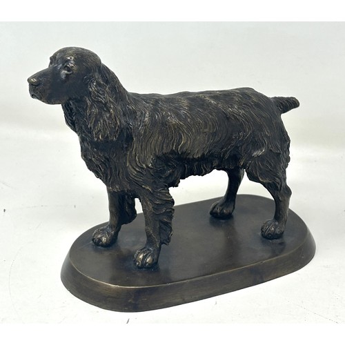 1024 - A bronze figure of a cocker spaniel, on a rounded rectangular base, 14 cm high, a bronze figure of a... 